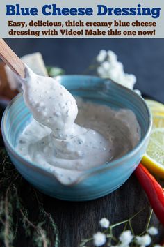 a blue bowl filled with white cheese dressing