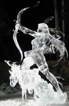 an ice sculpture of a woman on a horse with a bow and arrow in her hand