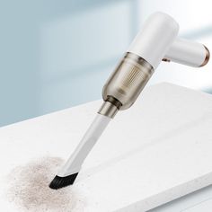 a close up of a hair dryer on top of a counter with dirt around it