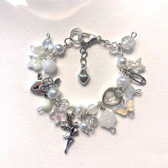 a bracelet with charms and beads on it