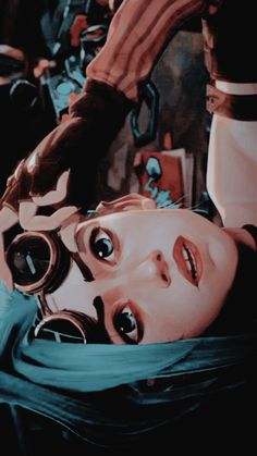 a woman with goggles laying on her head