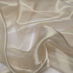 "SILK DESCRIPTION Condition: Brand new Silk #: TS-7203 Type of Silk: 12% Silk / 88% Metallic Description: White Silver Metallic Silk Organza Fabric Width: 44 inches Length: By the yard. Enter the quantity of yards you want (i.e. Qty of 3 will be 3 yards). The yards will be shipped in a continuous piece unless specified SWATCHES: We recommend buying swatch samples of our silks so you can see the exact feel/color of the silk. Please see our shop for the Swatch Sample listing. Swatches are at least Silk Organza Fabric, Dupioni Silk, Costume Contest, Design Research, Metallic Fabric, Organza Fabric, Silk Yarn, Silk Organza, Design Reference