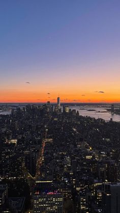 an aerial view of new york city at sunset