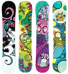 three snowboards with different designs on them, one is colorful and the other has an owl