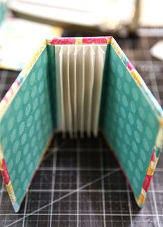 an open book sitting on top of a cutting board