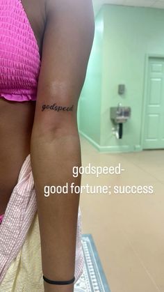 a woman with a tattoo on her arm and the words god speed, good fortune, success