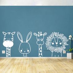 the wall decals are designed to look like zebras and giraffes