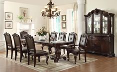 a dining room table with chairs around it