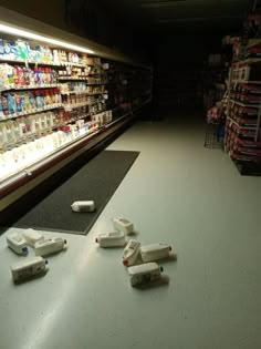 video game controllers are scattered on the floor in a grocery store's convenience section