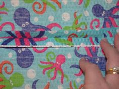 someone is sewing an octopus print fabric