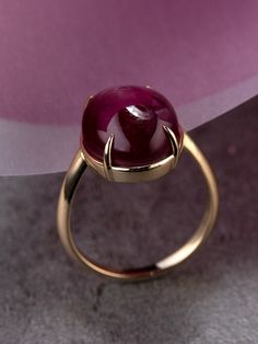 14k yellow gold ring with natural Star Ruby ruby origin - Thailand ruby measurements - 0.24 х 0.43 х 0.51 in / 6 х 11 х 13 mm stone weight - 12.30 carats ring size - 6.5 US ring weight - 4.76 grams ref No 12099 Worldwide shipping from Berlin, Germany Minimal collection Red Ruby Ring Gold, Red Stone Ring Women, Ruby Cabochon Ring, Star Ruby Ring, Yellow Gold Cocktail Ring, July Birthstone Ring, Ruby Ring Gold, Red Stone Ring, Gold Cocktail Ring