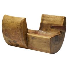 a wooden chair that is shaped like a boat