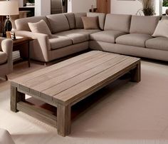 a living room filled with furniture and a wooden coffee table