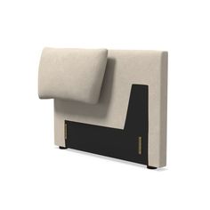 an upholstered headboard with black and beige fabric on the back, in front of a white background