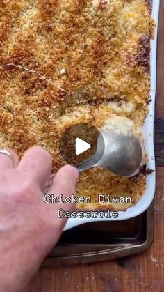 a person scooping some food out of a casserole dish