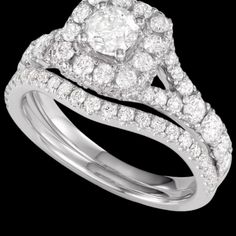 a diamond engagement ring set with two matching bands