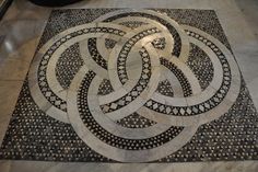 an intricate design on the floor in a room