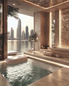 an indoor jacuzzi is shown in front of the cityscape and water