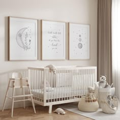 a baby's room with three framed pictures on the wall and two cribs