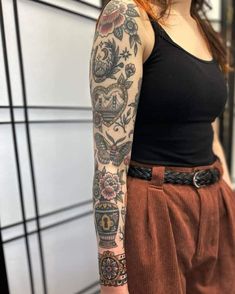 a woman with a tattoo on her arm