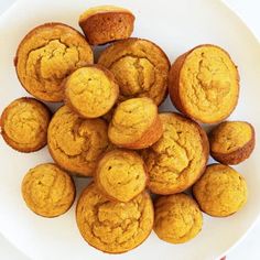 a white plate topped with muffins on top of a table