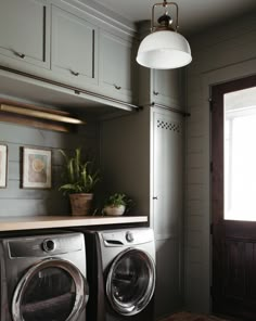 a washer and dryer in a small room