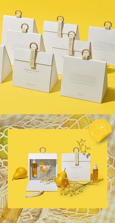 four white bags with handles are on a yellow background and there is also an image of lemons