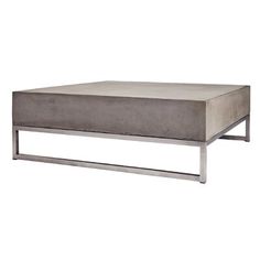 a concrete coffee table with metal legs