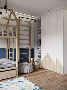 a child's bedroom with bunk beds and blue accent wall paint, wooden flooring