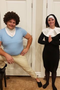 two people in costumes standing next to each other with their hands on their hipss