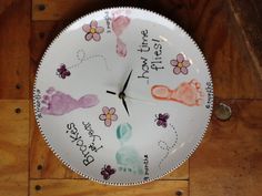 a clock with handprints on it that says, brookes get your how time flies