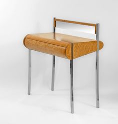 a small wooden table with a mirror on it's top and metal legs, against a white background