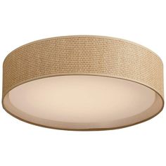 a round light fixture with beige fabric