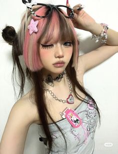 a girl with pink hair and glasses on her head is posing for the camera in front of a white wall