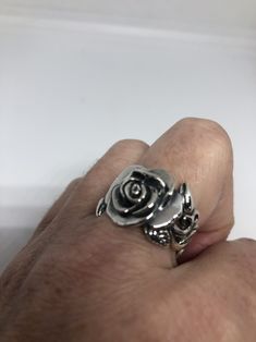 Lovely and delicate Rose flower ring 925 Sterling silver with black rhodium Size 8 or 8.75 can be re sized for you on request. My jeweler charges $10 All rings are shipped in a nice gift box. Check out our over a THOUSAND great reviews Engraving is $4 per letter and is not always perfect depending on the piece. It can take a few days if the jeweler is busy. This is payable to Paypal Judithsltd@gmail.com Flower Shaped Rings With Roses For Gift, Adjustable Rose Flower Ring, Silver Flower-shaped Rings With Rose Design, Rose Sterling Silver Ring Gift, Silver Rose Ring Jewelry, Rose Sterling Silver Rings As Gift, Rose Sterling Silver Rings For Gifts, Silver Flower Ring With Rose Design, Silver Rose Design Ring