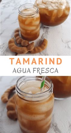 two jars filled with liquid sitting on top of a table