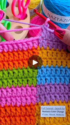 a colorful crochet basket with yarn in it