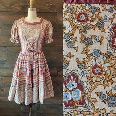 "- Vintage 70's square dance dress in plum, tan and goldenrod with allover blue floral - Scoop neckline with lace up bodice - Short puffed sleeve - Full skirt with ruffled hemline - Back zip closure MEASUREMENTS Bust: 33\" Waist: 25\" Hip: free Shoulder to waist: 15\" Waist to hem: 22\" Shoulder: 13.5\" Sleeve: 8.5\" Vintage labeled size: 6 Best fits: Modern XS / 2  LABEL Western Fashions FABRIC / FIBER 50% rayon / 50% cotton CONDITION Excellent, light wear" Vintage Square Neck Dresses For Fall, Fitted Vintage Dress With Floral Print And Square Neck, Fitted Vintage Prairie Dress With Square Neck, Fitted Peasant Dress With Square Neck For Spring, Vintage Prairie Dress With Square Neck For Spring, Vintage Prairie Dress With Square Neck For Fall, Fitted Peasant Dress With Ruffles For Fall, Fitted Ruffle Peasant Dress For Fall, Bohemian Prairie Dress With Square Neck For Summer