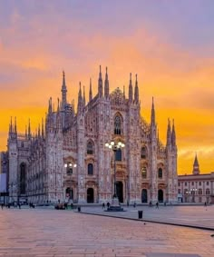 the cathedral is lit up at sunset in europe