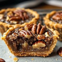 several pecan pies sitting on top of a table