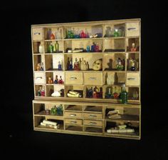 a wooden shelf filled with lots of bottles