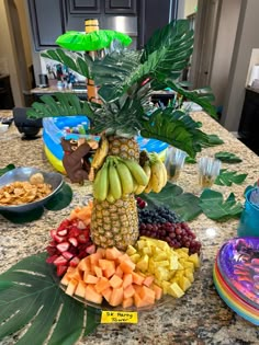 a table topped with lots of different types of fruits and veggies on top of it