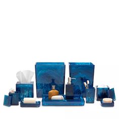 blue bathroom accessories set with soap dispenser and toiletries