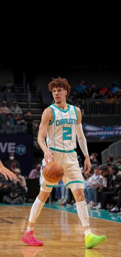 a basketball player dribbling the ball during a game