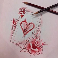 two pencils are next to a drawing of roses and hearts with the letter d on them