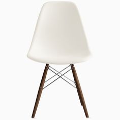 a white plastic chair with wooden legs and a brown wood base, viewed from the front