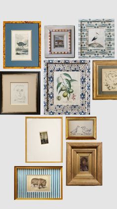 many different framed pictures are hanging on the wall with blue and white stripes around them