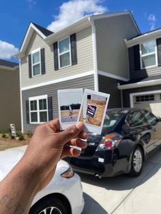 a person holding up two photos in front of a house with a car parked next to it