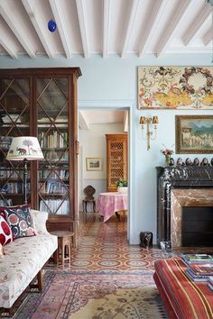 a living room filled with furniture and a fire place