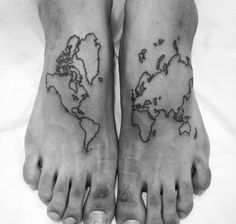 two feet with the world map tattooed on one side and an arrow tattoo on the other